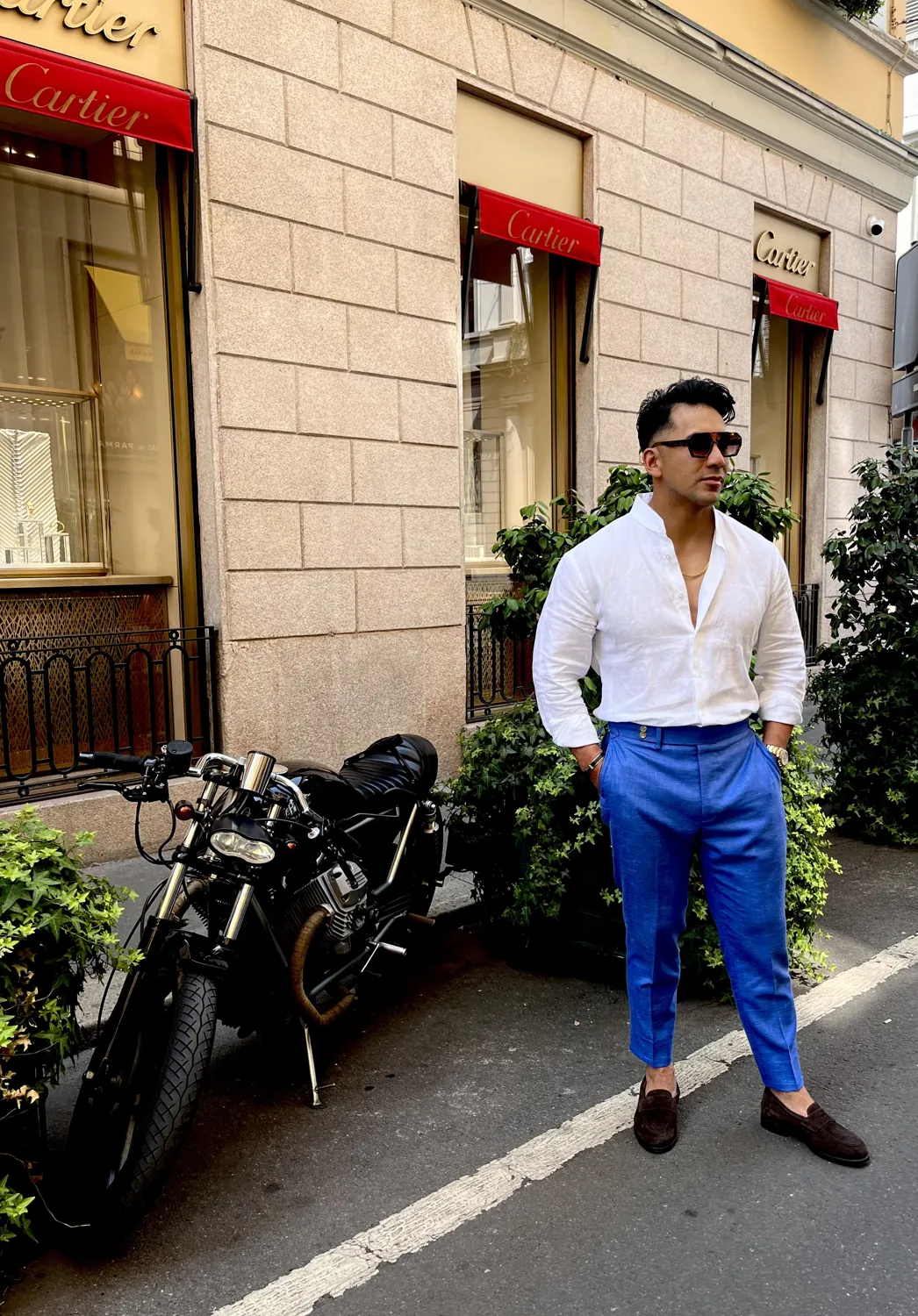 A white made to measure shirt worn open collar with cobalt trousers.